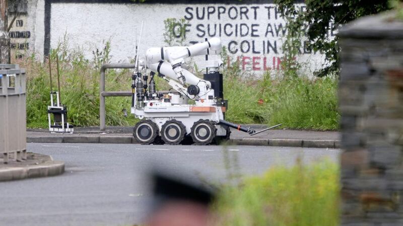 Police and army bomb disposal officers at the scene of a security alert in west Belfast today. Picture by Mal McCann