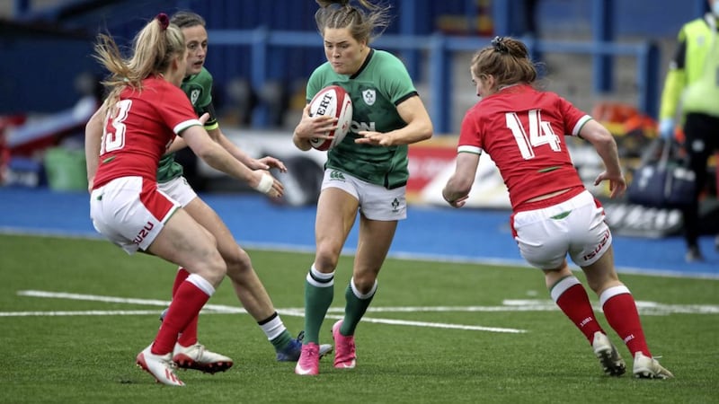 Ireland&#39;s Beibhinn Parsons attempts to evade the tackle from Wales&#39; Hannah Jones (left) and Lisa Neumann (right) during Saturday&#39;s Guinness Six Nations match at Cardiff Arms Park Picture by PA 
