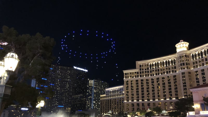 A swarm of light-carrying drones performed for crowds on the Las Vegas Strip.