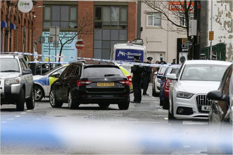 Police at the scene in Academy Street Picture By Hugh Russell.. 