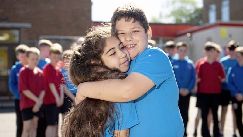 Tatiana Silva gets a hug from her brother Eduardo at St Mary&#39;s Primary School, Pomeroy. Picture by Mark Marlow 