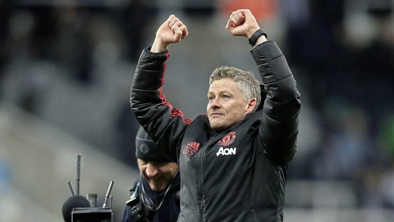 Manchester United interim manager Ole Gunnar Solskjaer applauds the away support after victory over Newcastle 