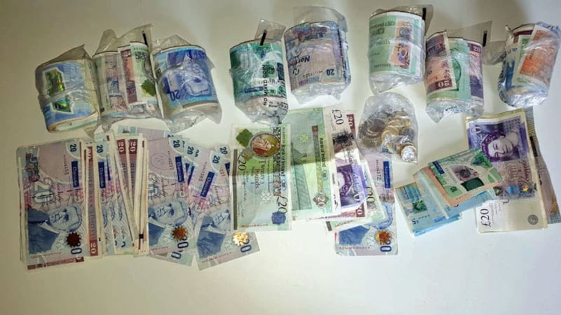 Cash which was seized and two men arrested following police raids on an alleged illegal waste disposal scheme with links to dissident republicans. Picture: PSNI/PA Wire&nbsp;