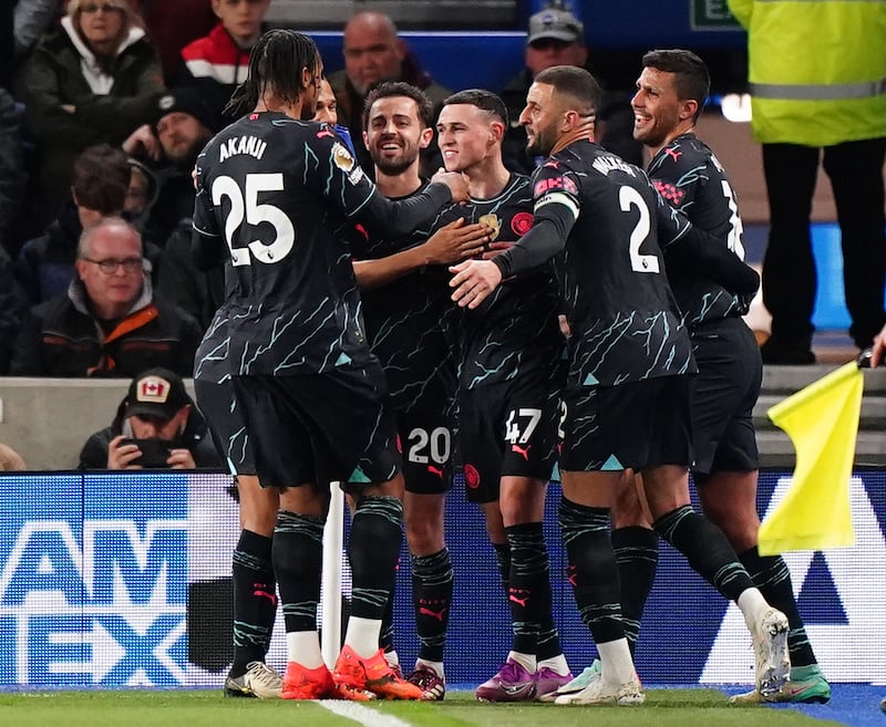 Phil Foden (centre) celebrates after doubling the lead