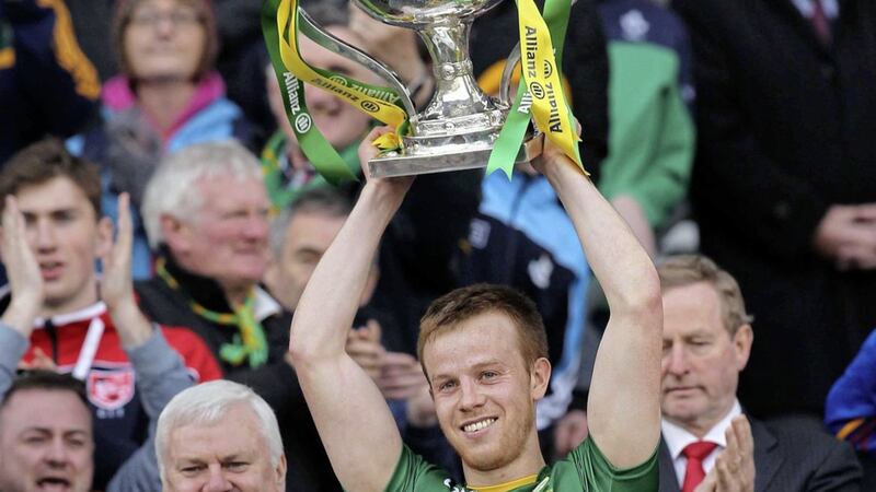 Kerry skipper Fionn Fitzgerald lifts the Division One trophy after their one-point win over Dublin 
