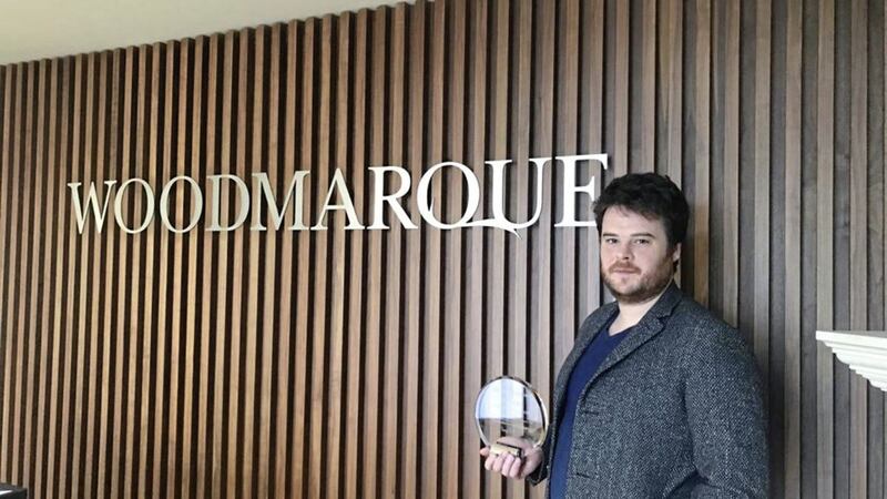 Woodmarque graduate Sean McKenna with the InterTradeIreland award 
