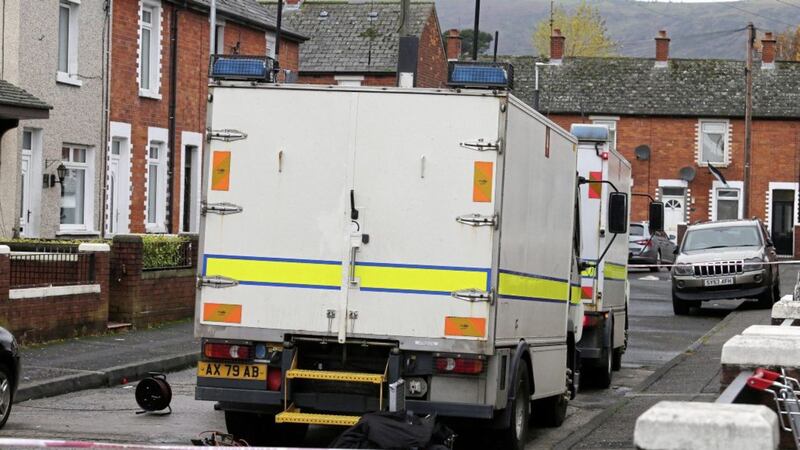 Police and army bomb disposal officers at the scene in Rodney Drive, west Belfast. Picture by Mal McCann 