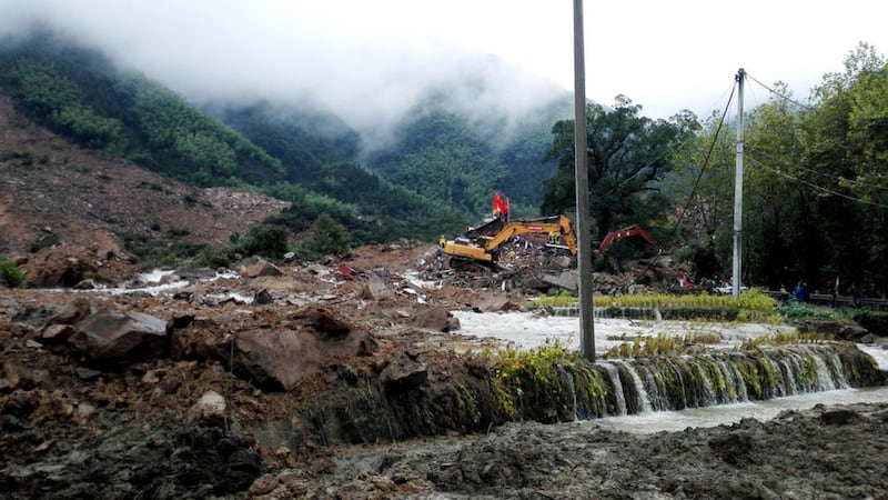 Rescuers use heavy equipment to search for survivors following a landslide in Sucun village in eastern China&#39;s Zhejiang Province Thursdaya. Picture by Chinatopix via Associated Press 