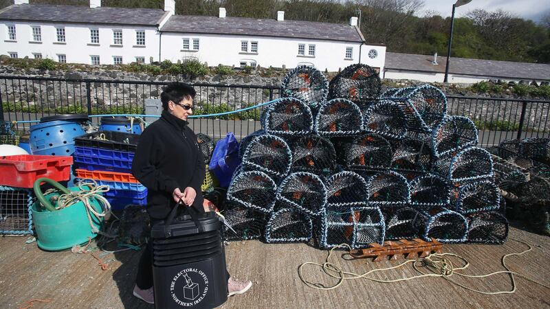 Senior presiding officer Teresa McCurdy arrives back on Rathlin Island, having collected a ballot box for the island's population of just over 100 people&nbsp;