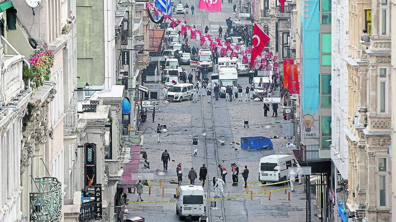 Emergency services at the scene of an explosion, on a street, in Istanbul, Turkey. Picture by Emrah Gurel, Associated Press