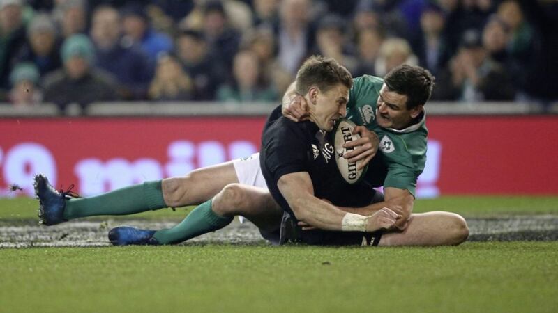 Ireland's Johnnie Sexton battles with New Zealand's Beauden Barrett during Saturday's autumn international at the Aviva Stadium<br />Picture by PA