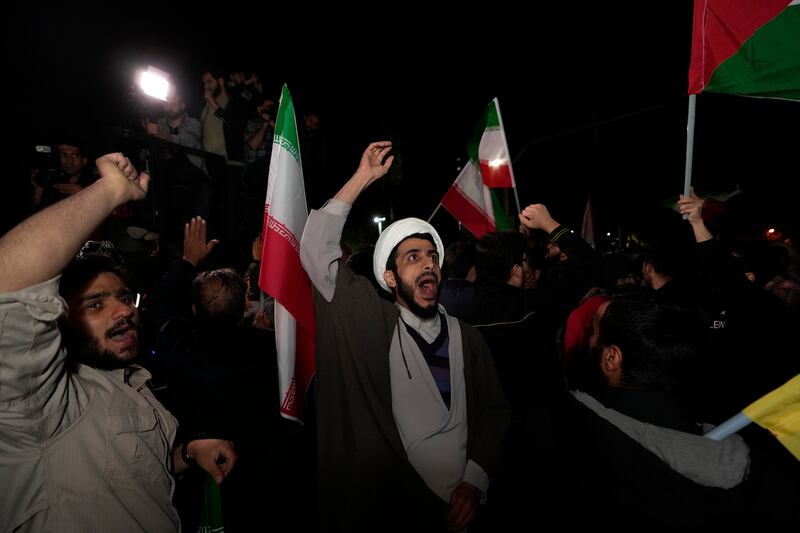 Iranian demonstrators chant slogans during their anti-Israeli gathering in front of the British embassy in Tehran, Iran (Vahid Salemi/AP)