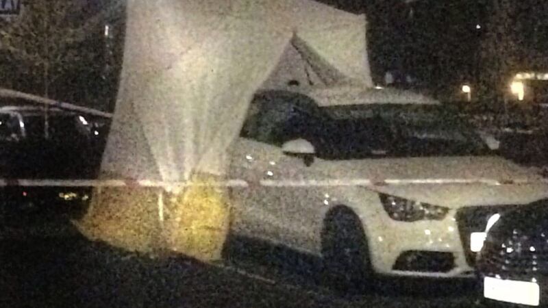 A car is partly covered with a police forensic tent in the grounds of Altnagelvin Hospital in Derry on Thursday night. Picture by Margaret McLaughlin  