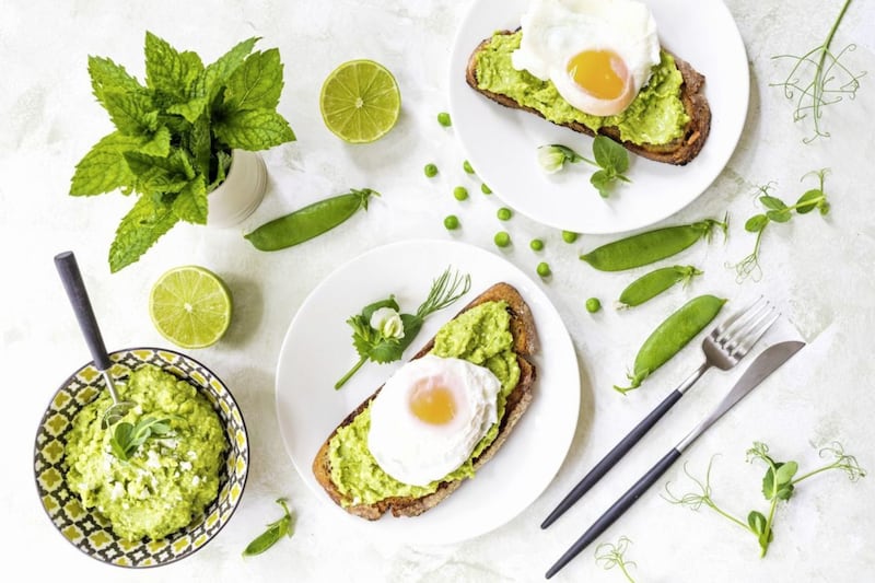 Avocado, peas and feta on toast with poached eggs 