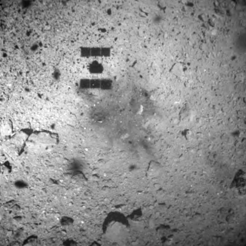 The shadow, centre above, of the Hayabusa2 spacecraft after its successful touchdown on the asteroid Ryugu