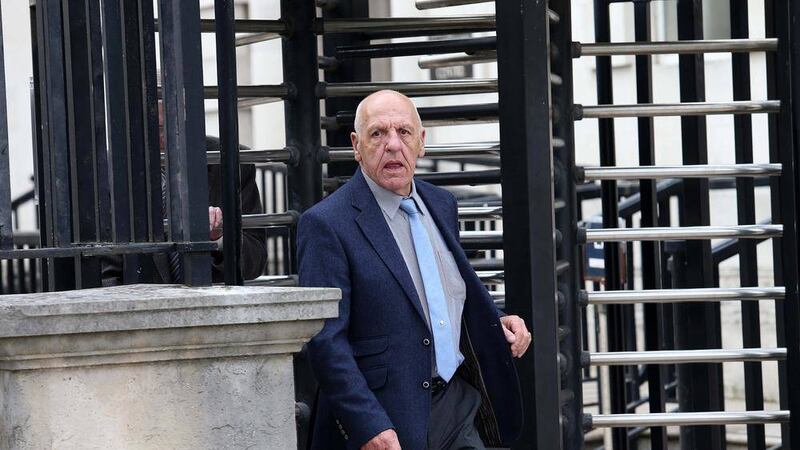 One of the hooden men Kevin Hannaway leaves Belfast High Court in June 2015  Picture Mal McCann. 