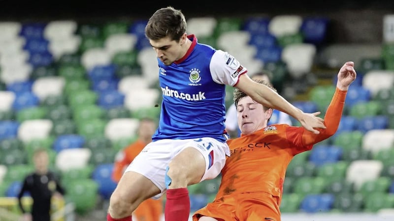 Linfield&#39;s Cameron Palmer is tackled during Saturday&#39;s game at Windsor Park Picture by David Maginnis/Pacemaker 
