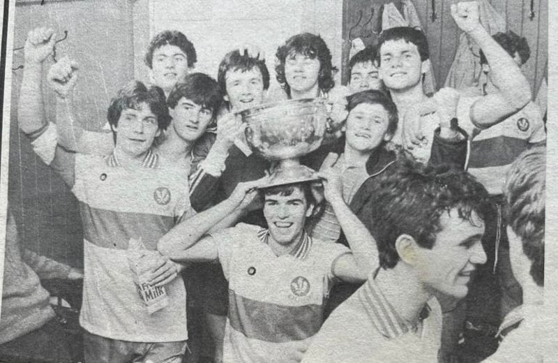 Odhran Lynch's father Eamon wears the Tom Markham Cup as a hat following Derry's 1983 All-Ireland minor success, when he played full-forward. 