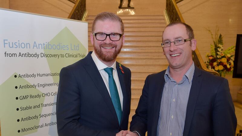 Managing Director of Fusion Antibodies Dr Paul Kerr pictured with Economy Minister Simon Hamilton