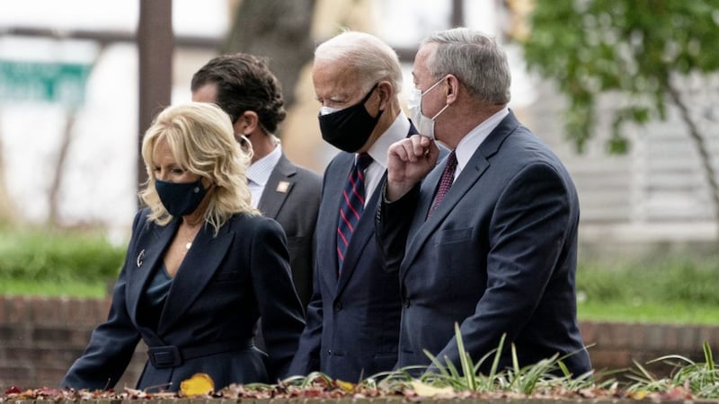 US President-elect Joe Biden, centre, with his wife Jill and Philadelphia Mayor Jim Kenney. Picture by Alex Brandon/AP