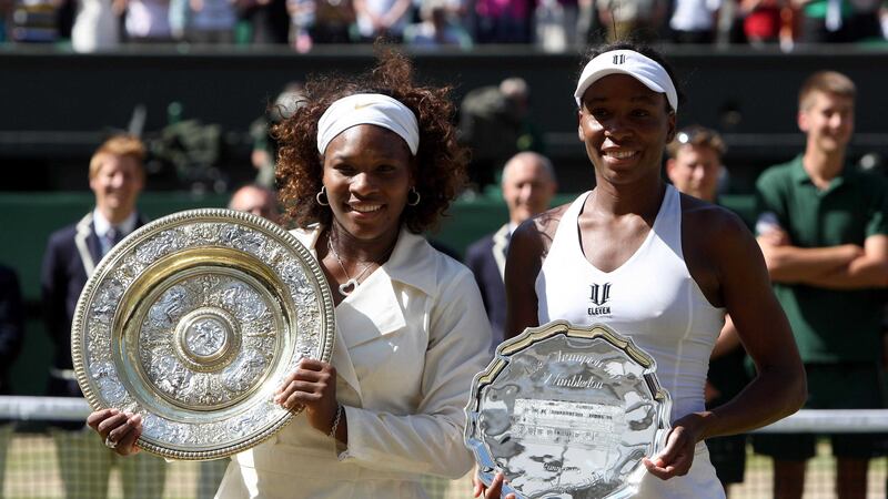 Sisters Serena Williams and Venus Williams (USA) with their trophies after the 2009 Wimbledon&nbsp;Ladies final at the All England Lawn Tennis and Croquet Club, Wimbledon.
