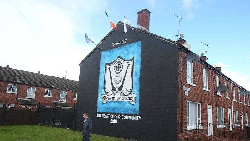 The Ardoyne Kickhams club logo is restored to the wall where an iconic mural had been painted over 