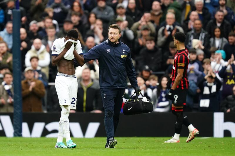 Pape Sarr, left, was distraught after suffering injury in Spurs’ win over Bournemouth on New Year’s Eve
