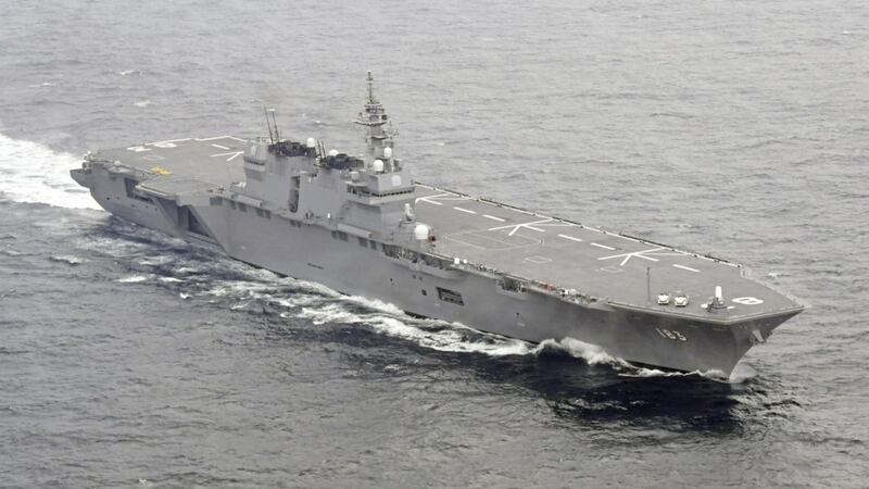 Japan&#39;s helicopter carrier Izumo sails in the waters off the Boso Peninsula, east of Tokyo, as it starts to escort a US supply ship after departing Yokosuka port, south of Tokyo on Monday. Japan&#39;s navy has dispatched its largest destroyer reportedly tasked with escorting US military ships off the Japanese coast, a first-time mission amid heightened tension on the Korean Peninsula PICTURE: Ren Onuma/Kyodo News/AP 