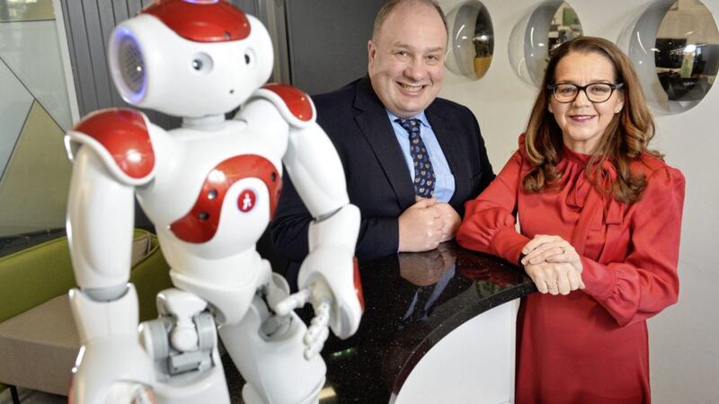 Deloitte has launched a new Robotics Automation Academy offering over twenty graduates the opportunity to join their Belfast office. Pictured are Jackie Henry, senior partner at Deloitte with Trevor Connolly, director of business engagement at the Department for the Economy. 