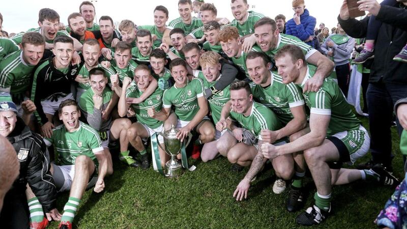 Cargin players celebrate winning the Padraig MacNamee Cup at Ahoghill yesterday Picture Seamus Loughran. 