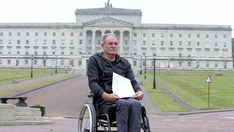 Christy Cummings who was left paralysed from the chest down following a loyalist gun attack in December 1997, delivered a legal letter to the Northern Ireland Office at Stormont House yesterday. Picture by Mal McCann. 