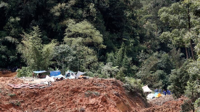 A landslide hit an organic farm in Batang Kali, Malaysia (FL Wong/AP)