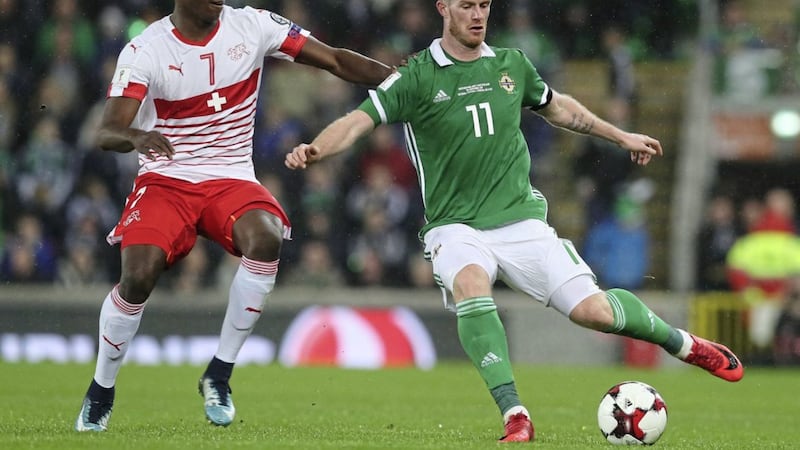 Chris Brunt in action for Northern Ireland at Windsor Park against Switzerland, the country against which he started and finished his international career. 