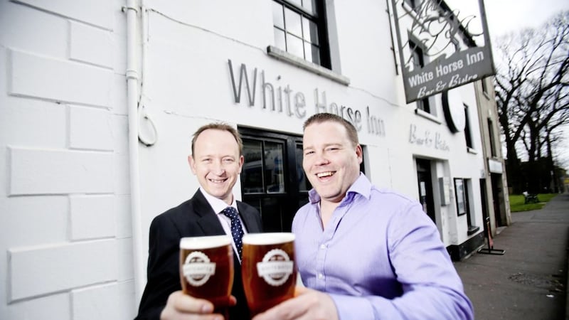 Publican Gavin Bates (right) toasts the White Horse deal with GVA NI director Gavin Weir 