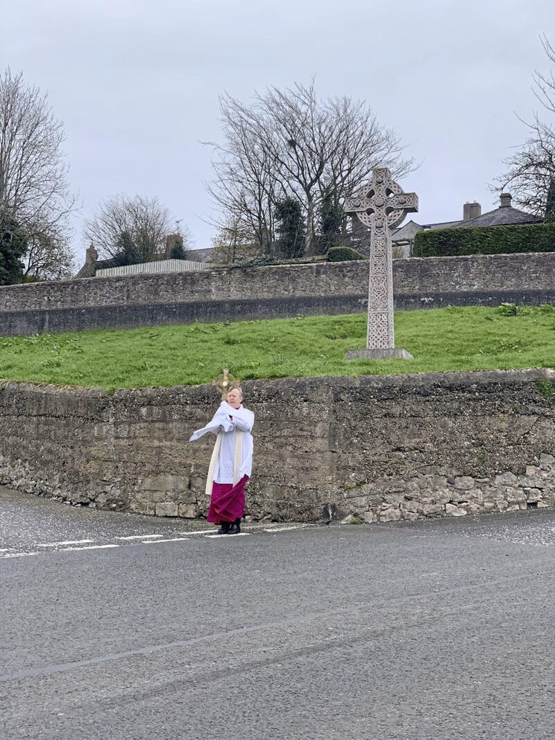 Archbishop Eamon Martin used his official &#39;exercise opportunity&#39; during a strict lockdown phase of the pandemic last year to bless the people of Armagh; the shape of the Monstrance is echoed in the Celtic cross behind him 