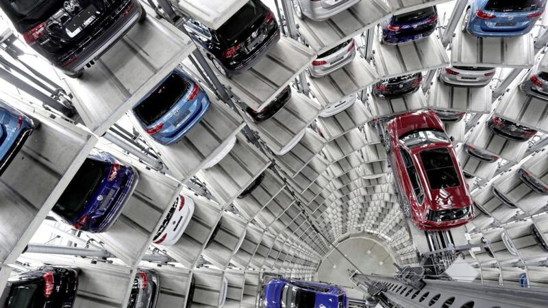 Volkswagen cars are lifted inside a delivery tower of the company in Wolfsburg, Germany. Picture by Michael Sohn, file, Associated Press 