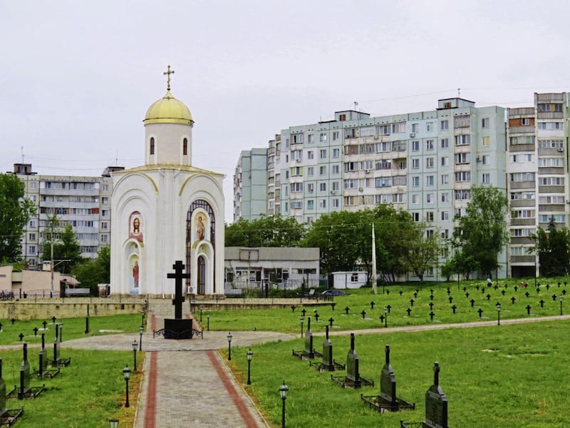 A church next to Soviet-era blocks in Transnistria 