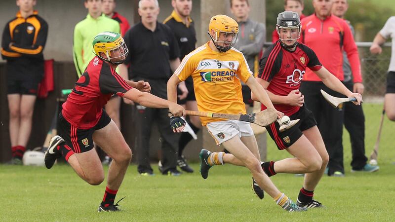 Antrim's Alec Delray and Down's Barry Trainor and Pearse McCrickard. Photograph By Declan Roughan&nbsp;