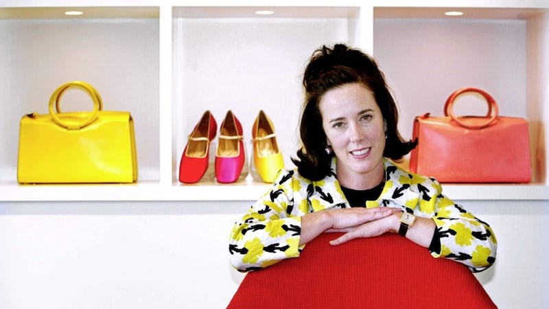 Designer Kate Spade poses with handbags and shoes. Picture by Bebeto Matthews/AP 