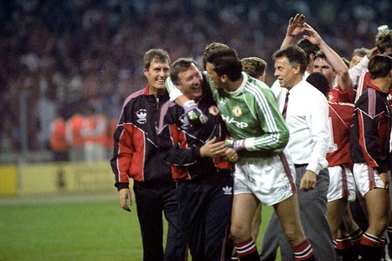 Sir Alex Ferguson celebrates with goalkeeper Les Sealey after winning the FA Cup in 1990