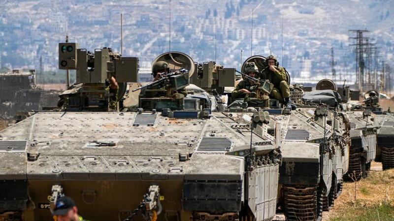 Israeli soldiers drive out of the occupied West Bank city of Jenin (Ariel Schalit/AP)