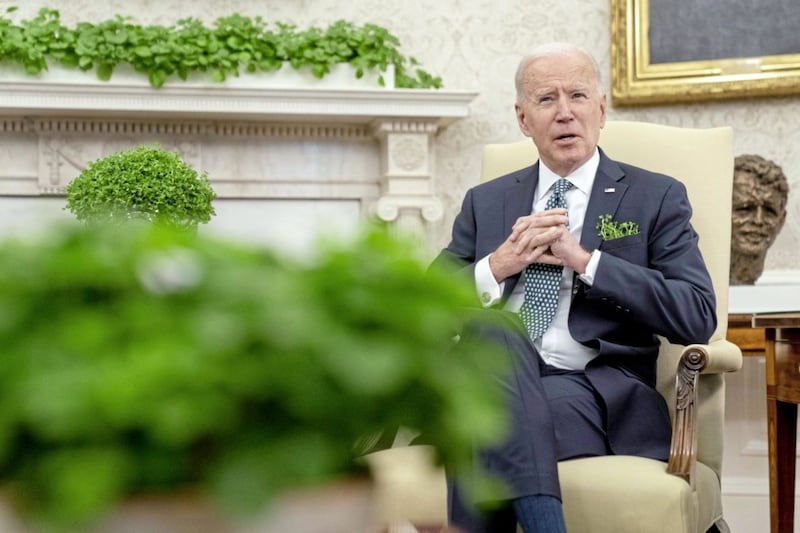 President Joe Biden in the Oval Office on St Patrick&#39;s Day 2021. Picture by AP Photo/Andrew Harnik 