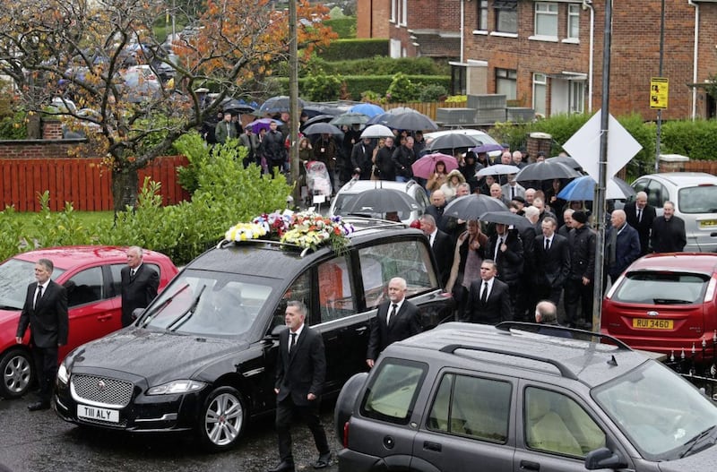 The funeral of Richard Glenholmes makes its way to St Agnes Church in west Belfast Picture Mal McCann. 