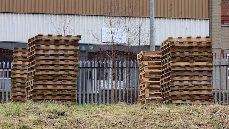 Wooden pallets being gathered near Mountcollyer Youth Centre in north Belfast. PICTURE: MAL MCCANN