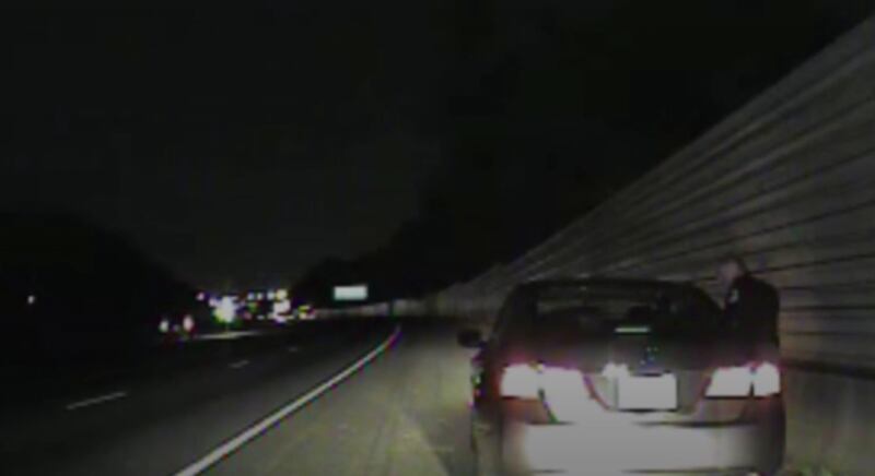 An image of Lieutenant Greg Abbott talking to a driver, taken from video from Cobb County Police Department