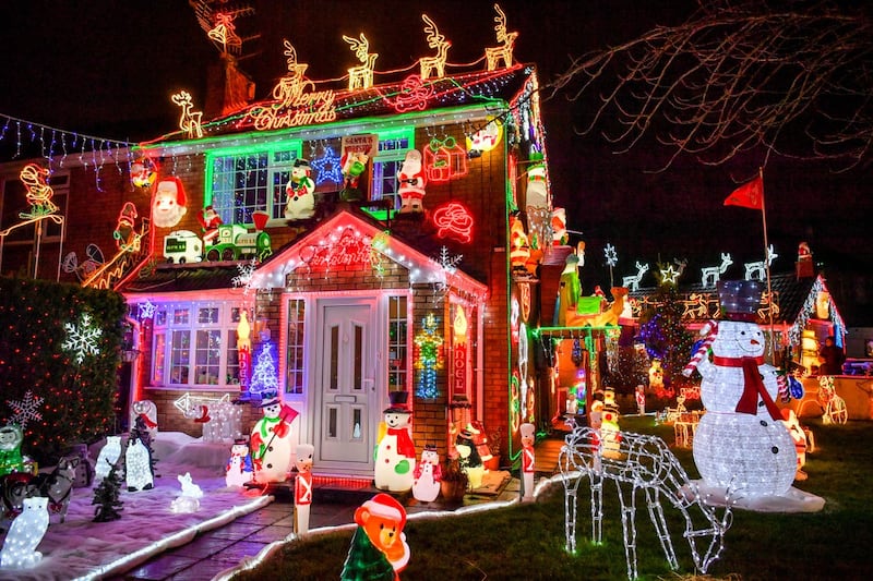 The house features more than 50,000 Christmas lights (Ben Birchall/PA)