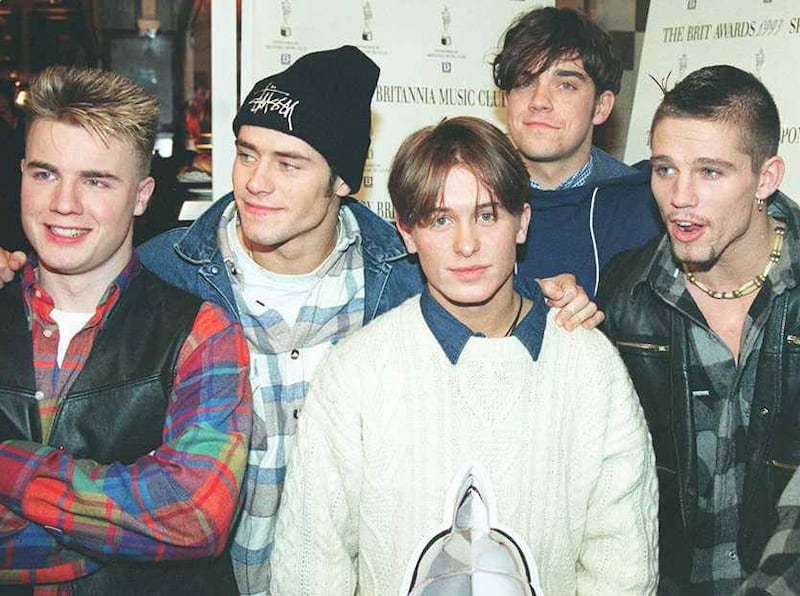 Williams (second right) found fame with Take That is the early 1990s