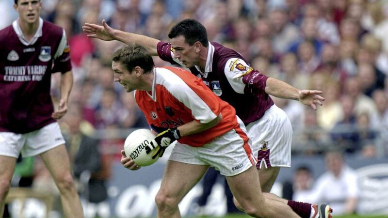 Kieran McGeeney and Padraig Joyce battle it out in 2001. They will manage their respective counties in Sunday&#39;s All-Ireland quarter-final. Photo by Damien Eagers/Sportsfile 