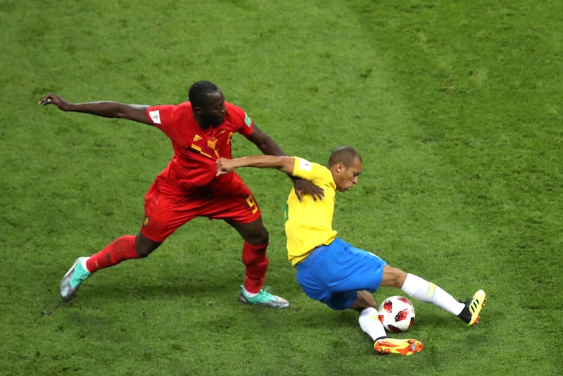 Belgium's Romelu Lukaku and Brazil's Miranda challenge for the ball at the 2018 World Cup