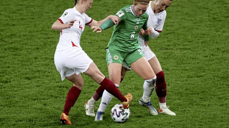 Northern Ireland&#39;s Marissa Callaghan battles with England&#39;s Keira Walsh (left) and Lucy Bronze during the Women&#39;s FIFA World Cup Qualifying match at Windsor Park. NI captain Callaghan has spoken up in support of manager Kenny Shiels after he caused controversy this week by saying &quot;women are more emotional than men&quot;. 